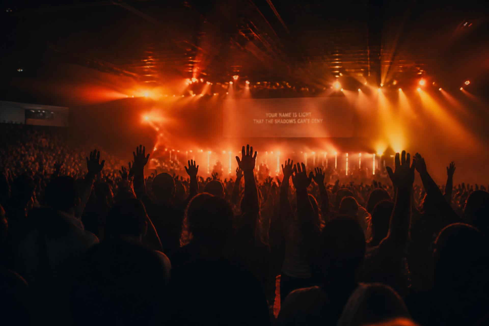 Congregation worshipping with hands raised